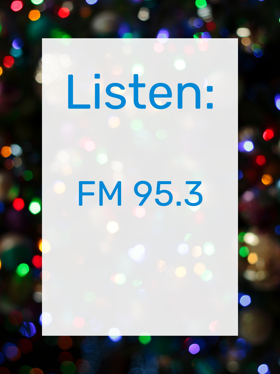 Blurred Christmas Lights Background with a white rectangle and blue text that says. "Listen: FM 95.3"